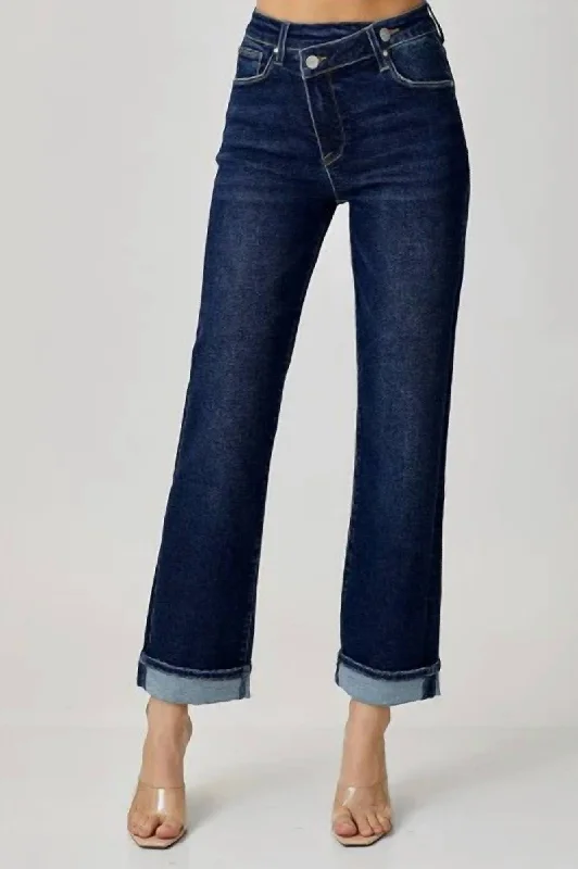 Limited Stock Mid Rise Cross Over Straight Leg Jeans In Medium Blue